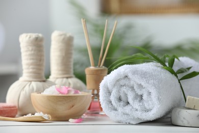 Photo of Beautiful composition with different spa products on white table against blurred background, closeup