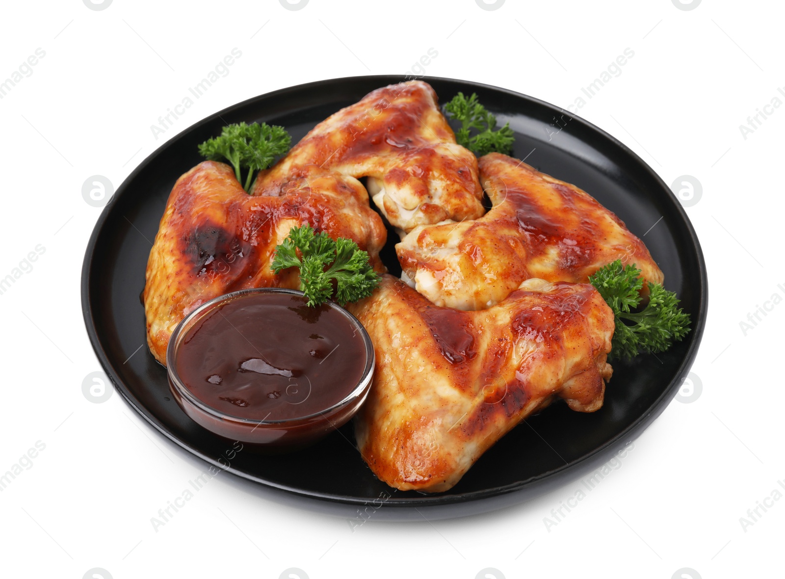 Photo of Plate with marinade and chicken wings isolated on white