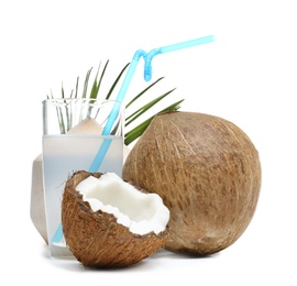 Photo of Glass of coconut milk and nuts on white background