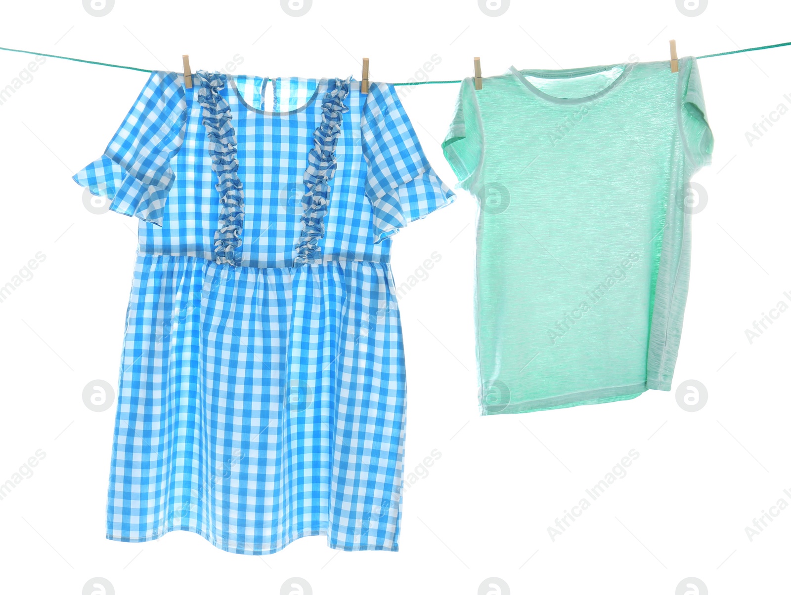 Photo of Clothes on laundry line against white background