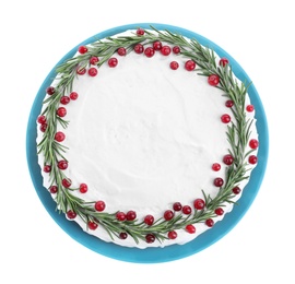 Photo of Traditional Christmas cake decorated with rosemary and cranberries isolated on white, top view