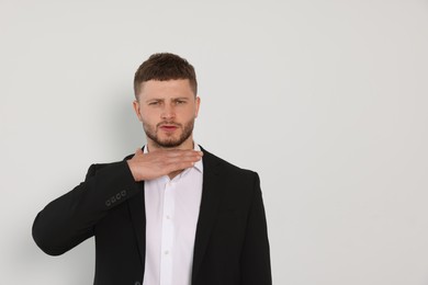 Photo of Aggressive young man on white background, space for text