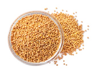 Mustard seeds with bowl isolated on white, top view