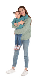 Young mother with little daughter on white background