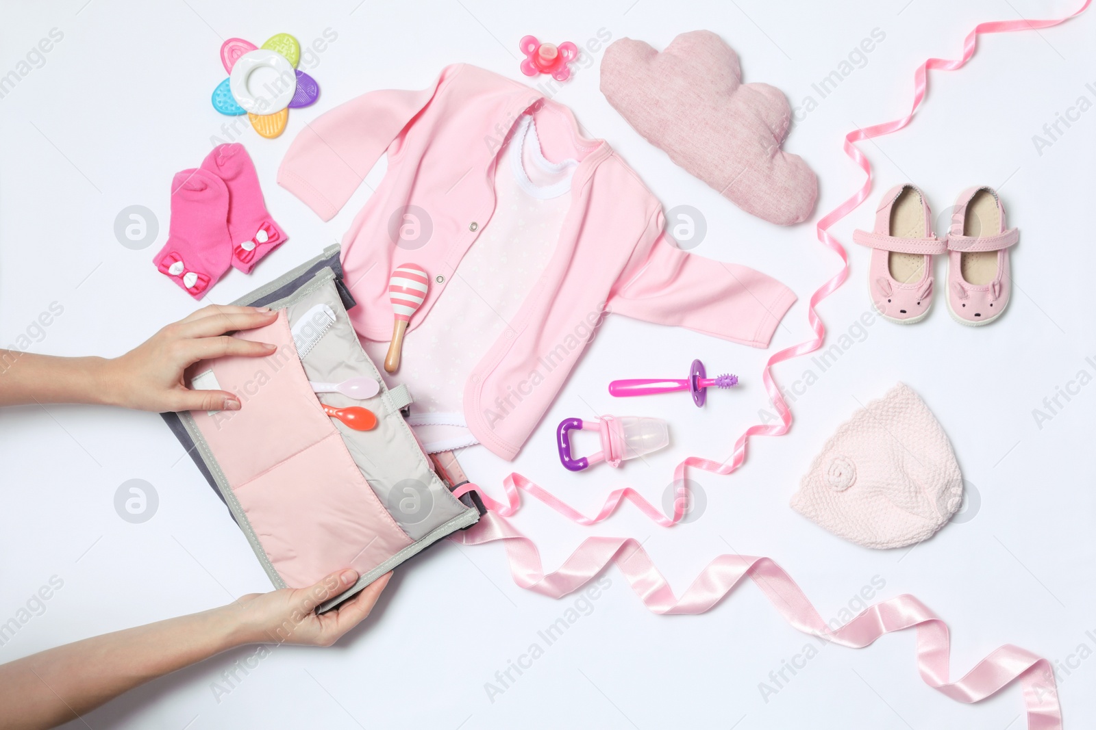 Photo of Woman with maternity bag and baby accessories on white background, top view