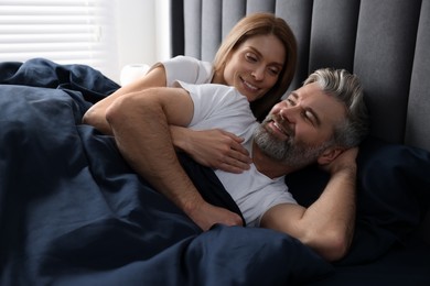 Photo of Lovely mature couple in bed at home
