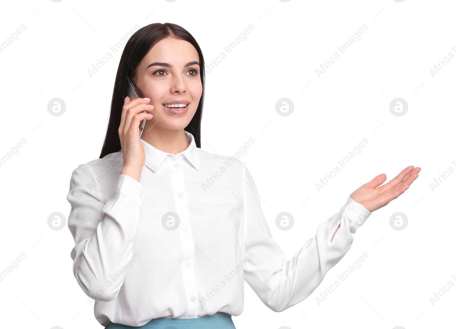 Photo of Young businesswoman talking on mobile phone against white background