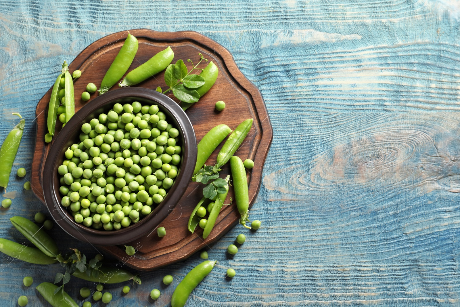 Photo of Flat lay composition with green peas on wooden background