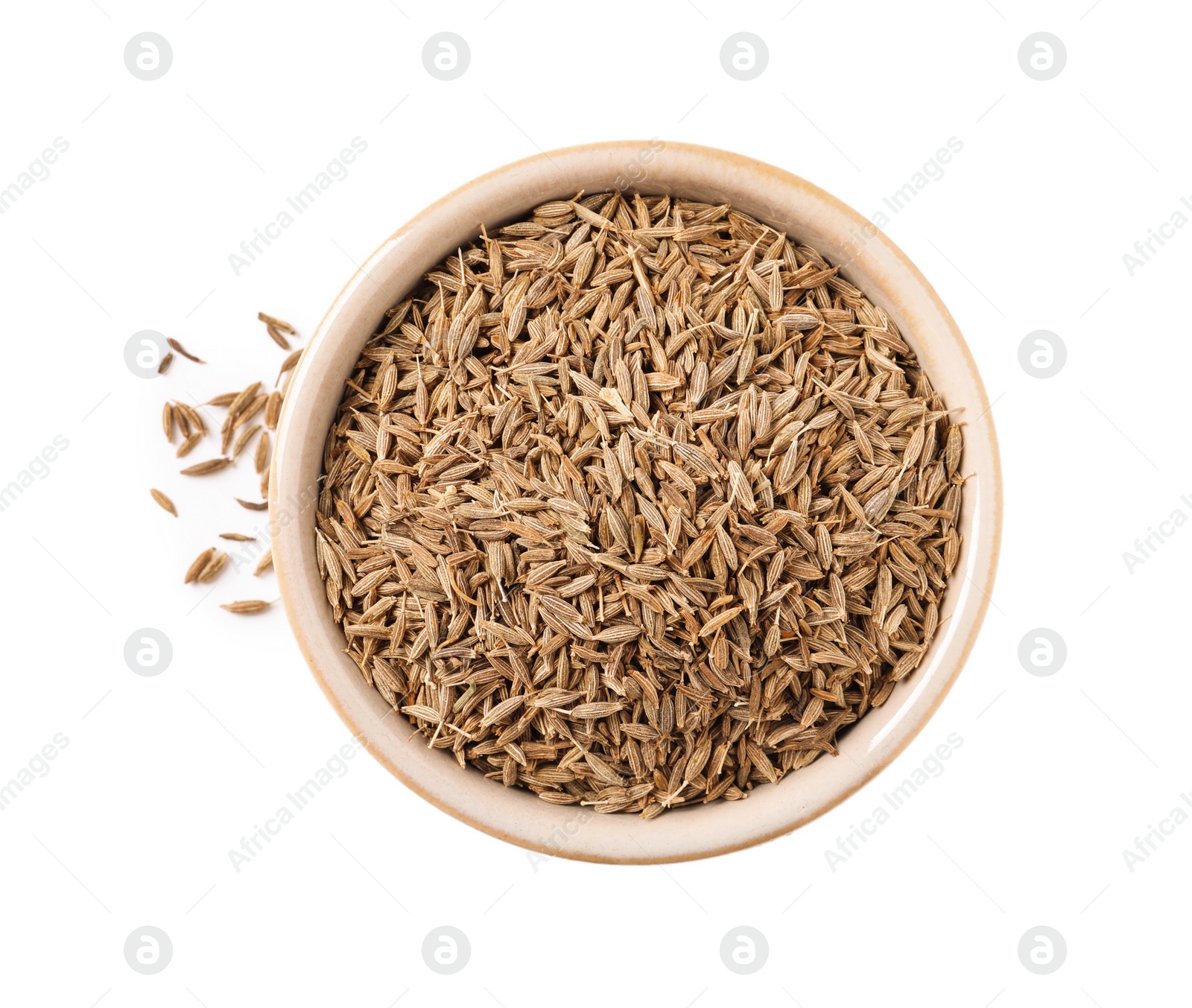 Photo of Bowl of aromatic caraway (Persian cumin) seeds isolated on white, top view