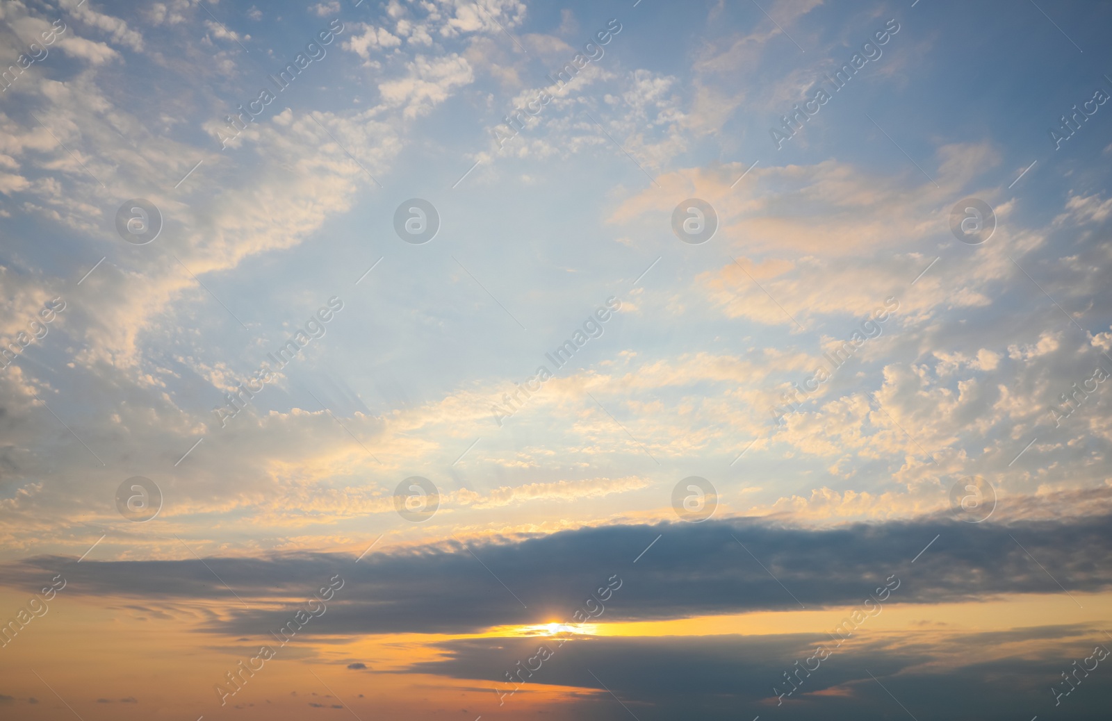 Photo of Picturesque view of sunset with beautiful clouds