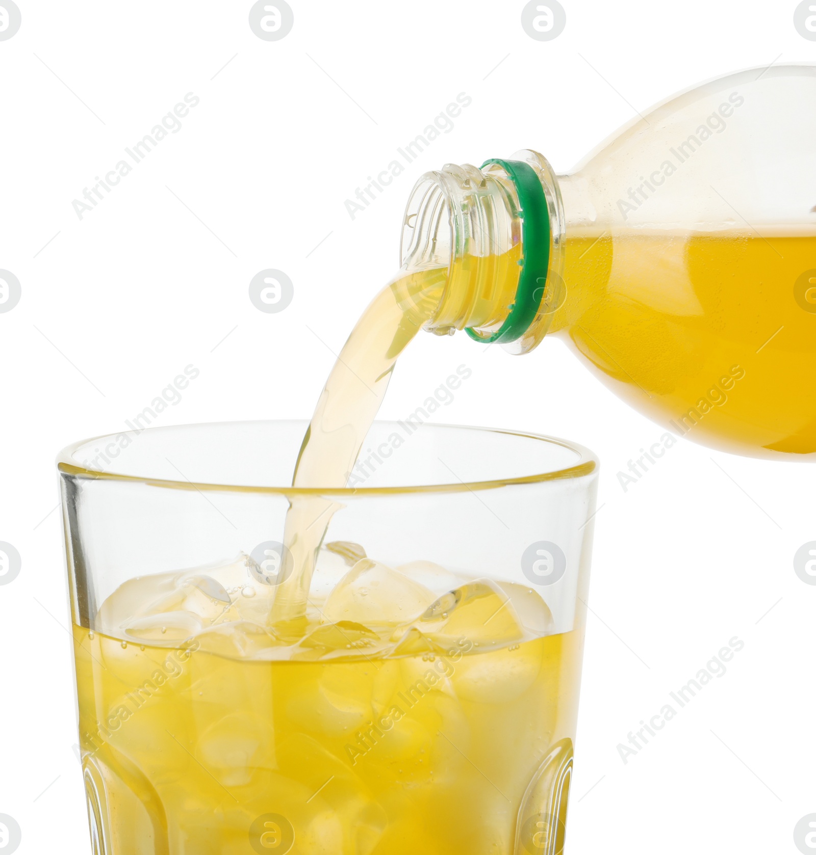 Photo of Pouring delicious orange soda water from bottle into glass on white background