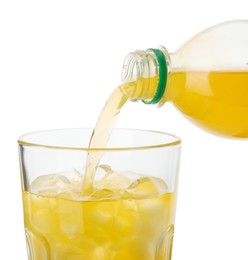 Photo of Pouring delicious orange soda water from bottle into glass on white background