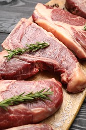 Photo of Pieces of raw beef meat on table, closeup