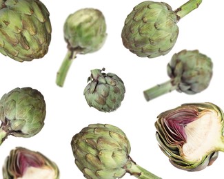 Image of Fresh raw artichokes falling on white background