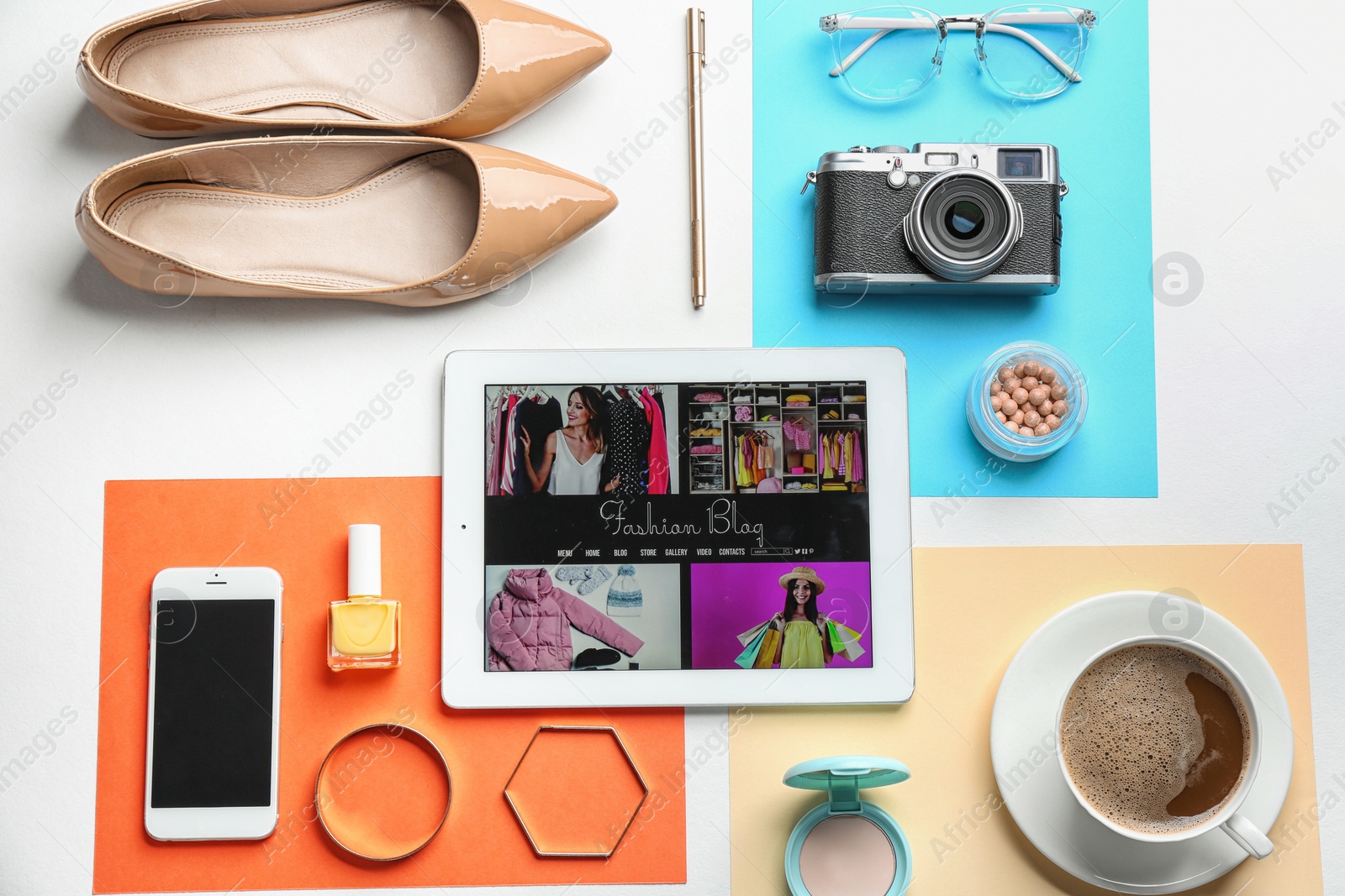 Photo of Flat lay composition with tablet and fashion blogger's stuff on color background