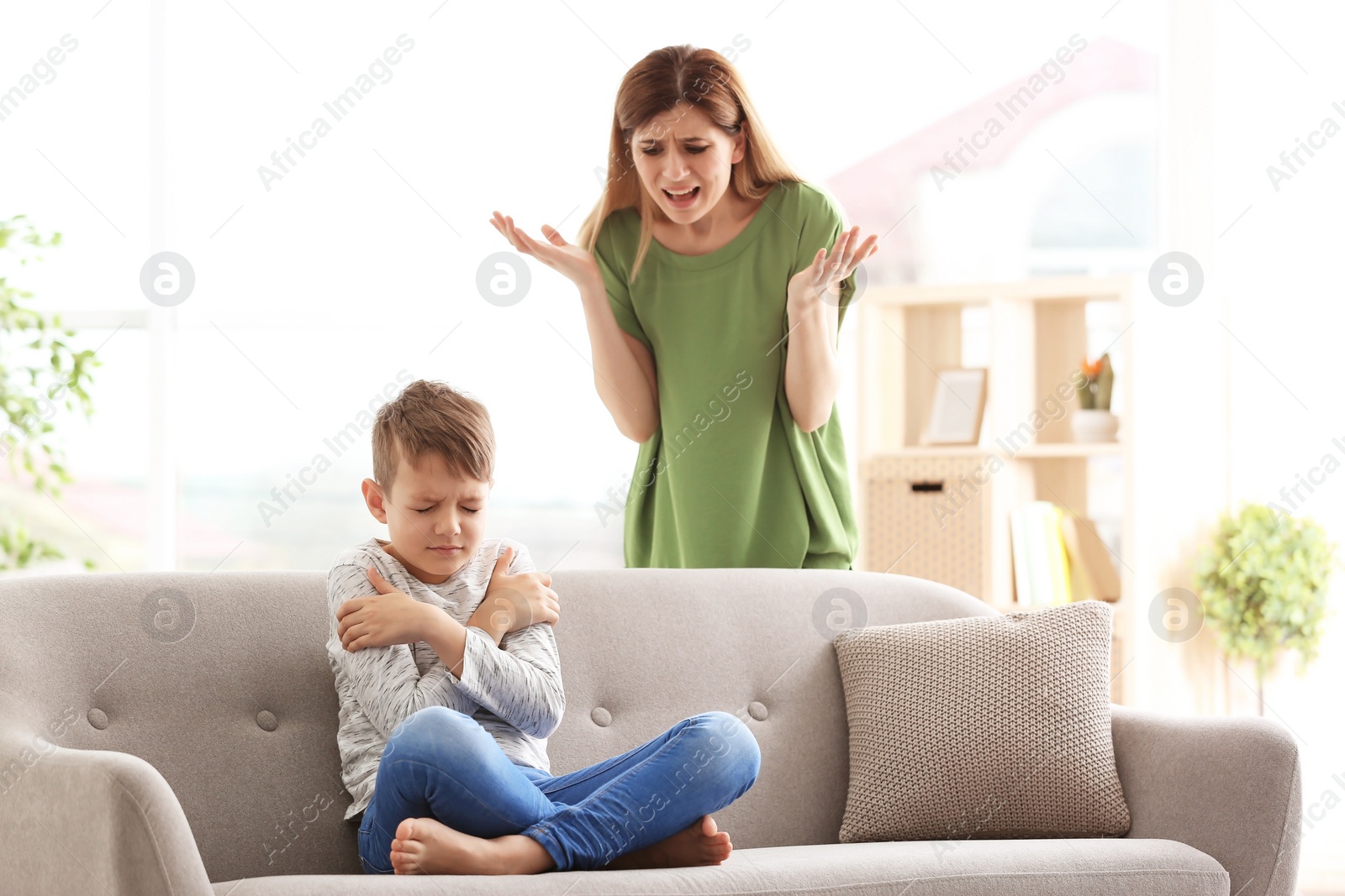 Photo of Mother arguing with son at home
