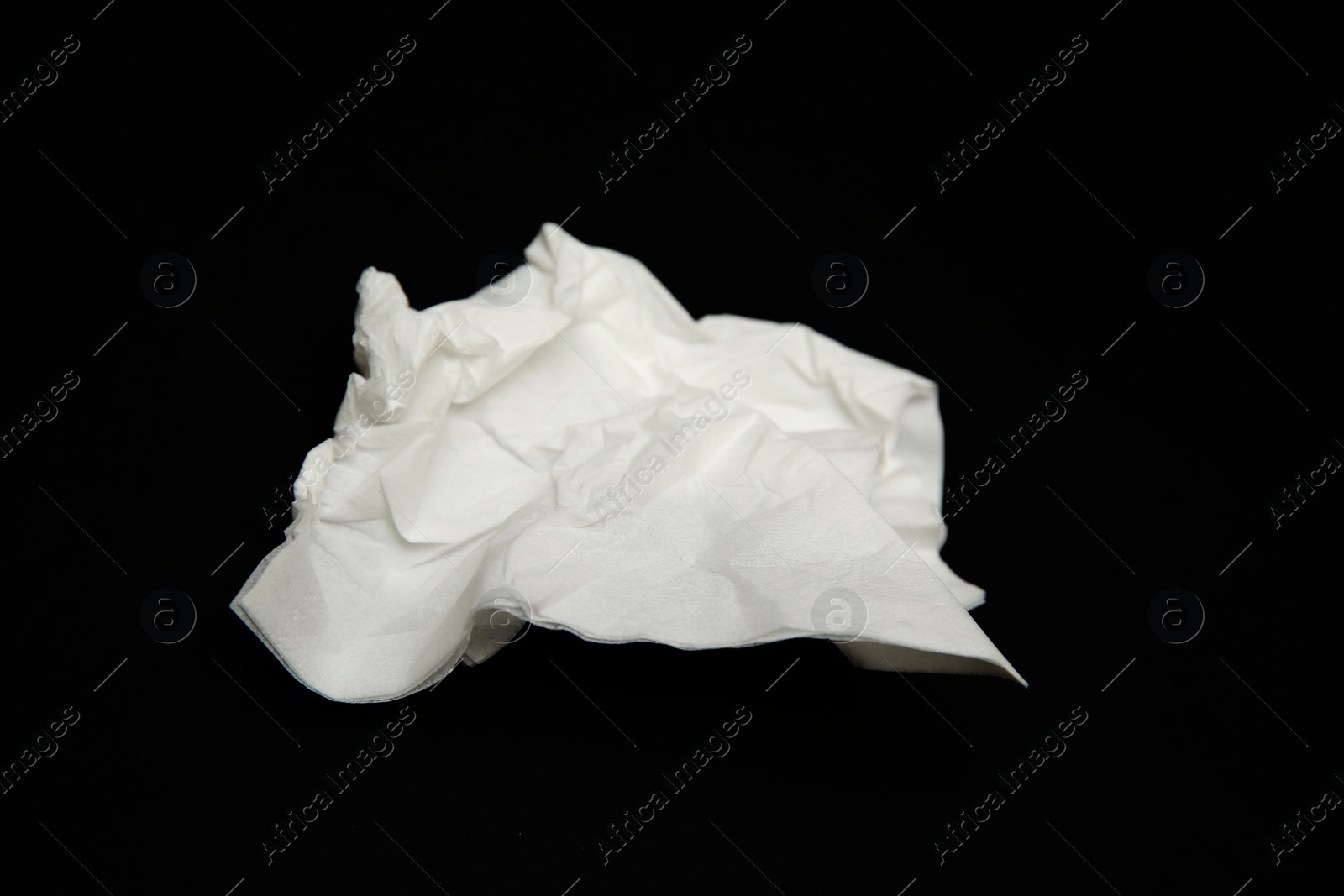 Photo of Used white paper tissue on black background