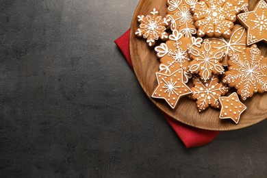 Photo of Tasty Christmas cookies on grey table, top view. Space for text