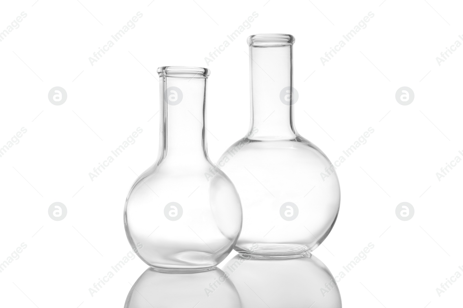 Photo of Empty Florence flasks on white background. Laboratory glassware