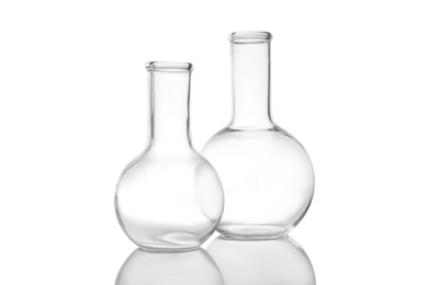 Photo of Empty Florence flasks on white background. Laboratory glassware