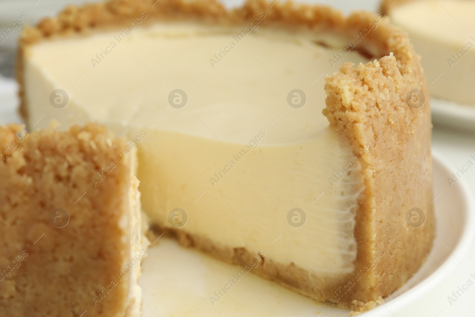 Photo of Tasty vegan tofu cheesecake on plate, closeup