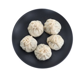 Photo of Plate with tasty fresh khinkali (dumplings) and spices isolated on white, top view. Georgian cuisine