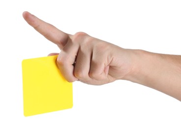 Referee holding yellow card and pointing on white background, closeup