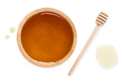 Photo of Tasty honey in bowl and dipper on white background, flat lay