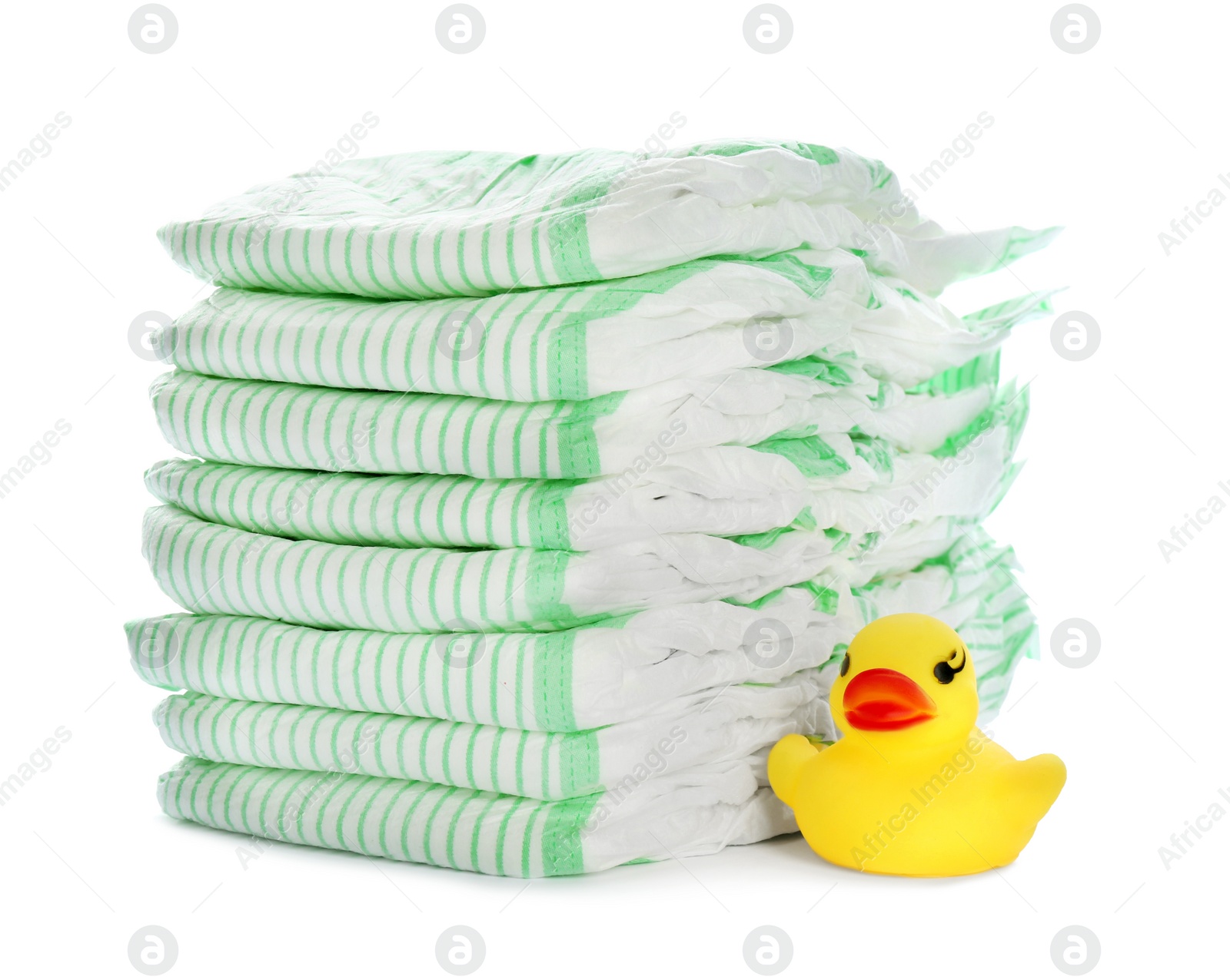 Photo of Stack of disposable diapers and toy duck on white background. Baby accessories