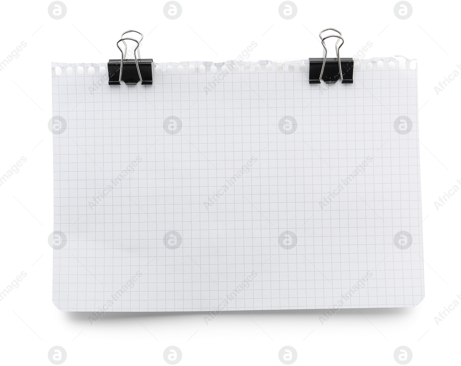 Photo of Checkered notebook sheet with binder clips isolated on white, top view