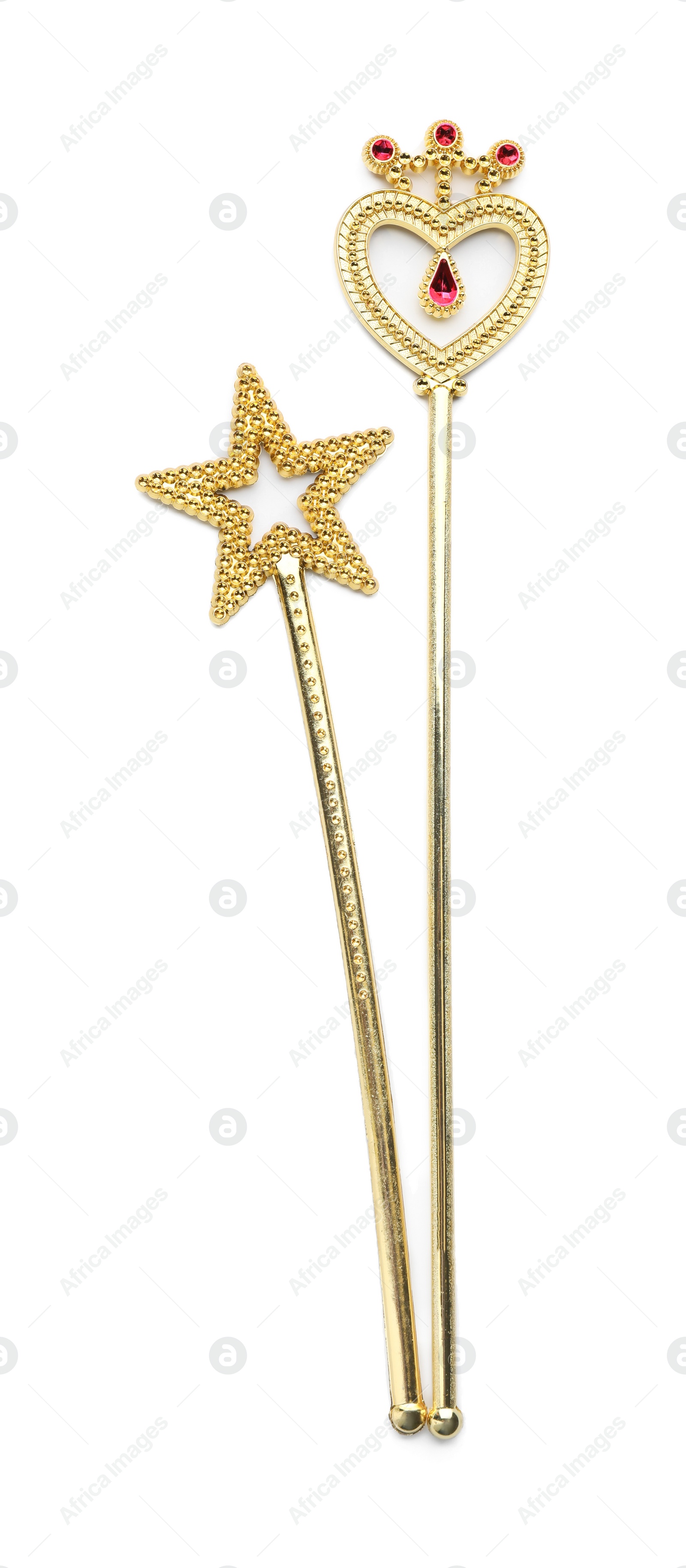 Photo of Beautiful golden magic wands on white background, top view