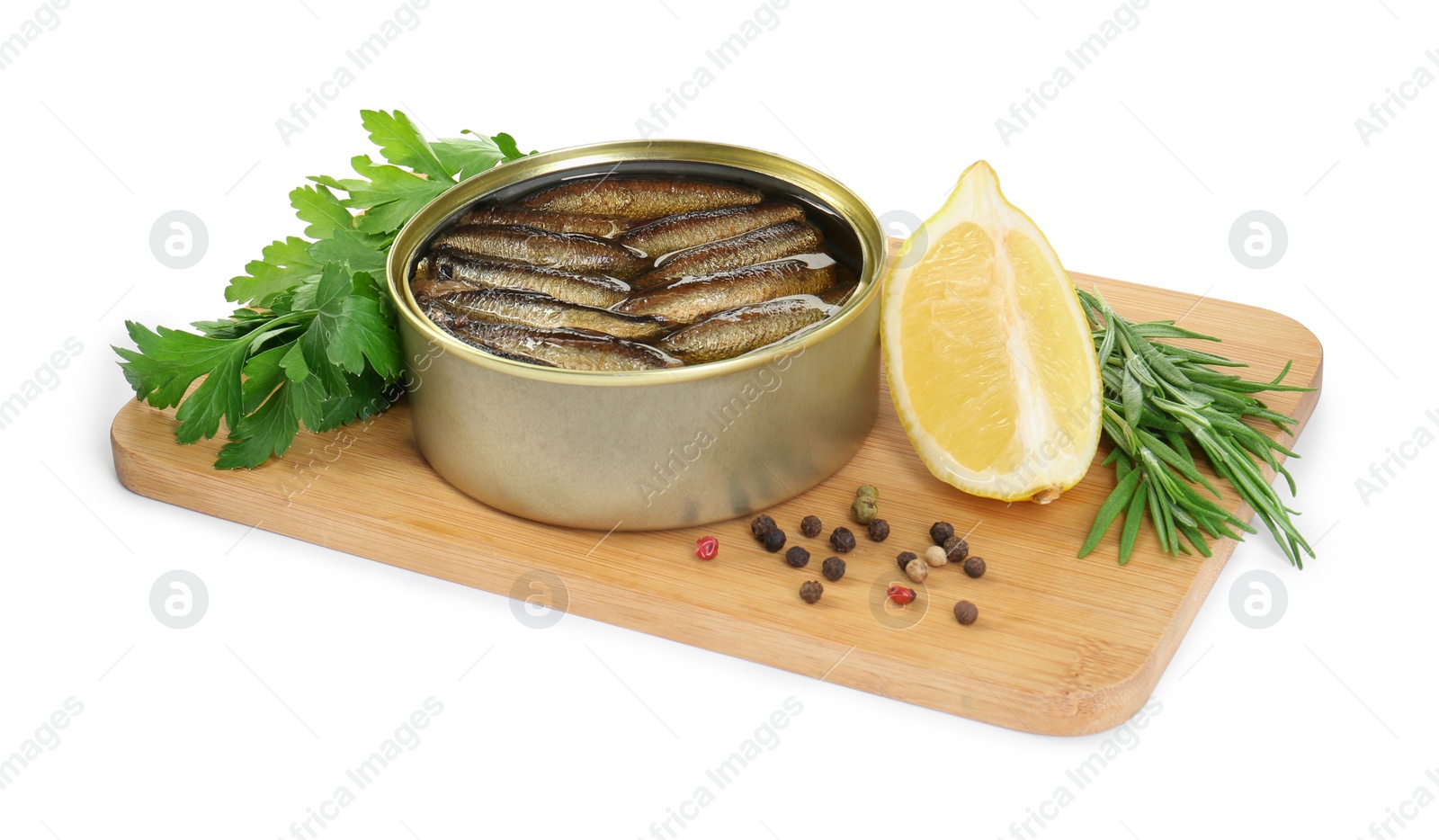 Photo of Board with canned sprats, herbs, peppercorns and slice of lemon isolated on white