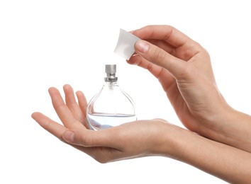 Photo of Young woman with perfume bottle on white background, closeup