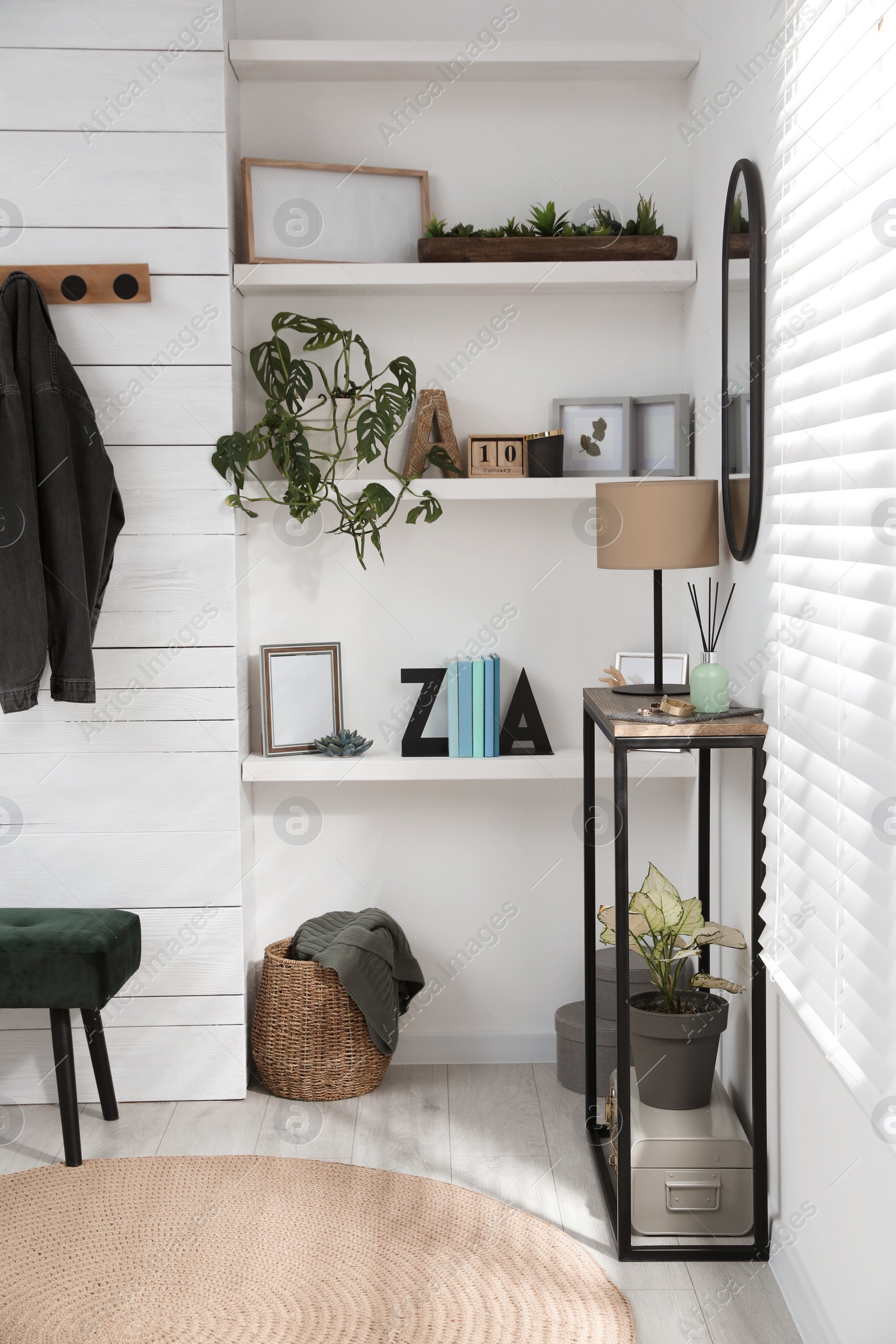 Photo of Hallway interior with console table and stylish decor