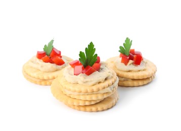 Photo of Delicious crackers with humus, bell pepper and parsley on white background