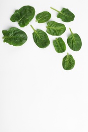 Fresh leaves of spinach isolated on white, top view