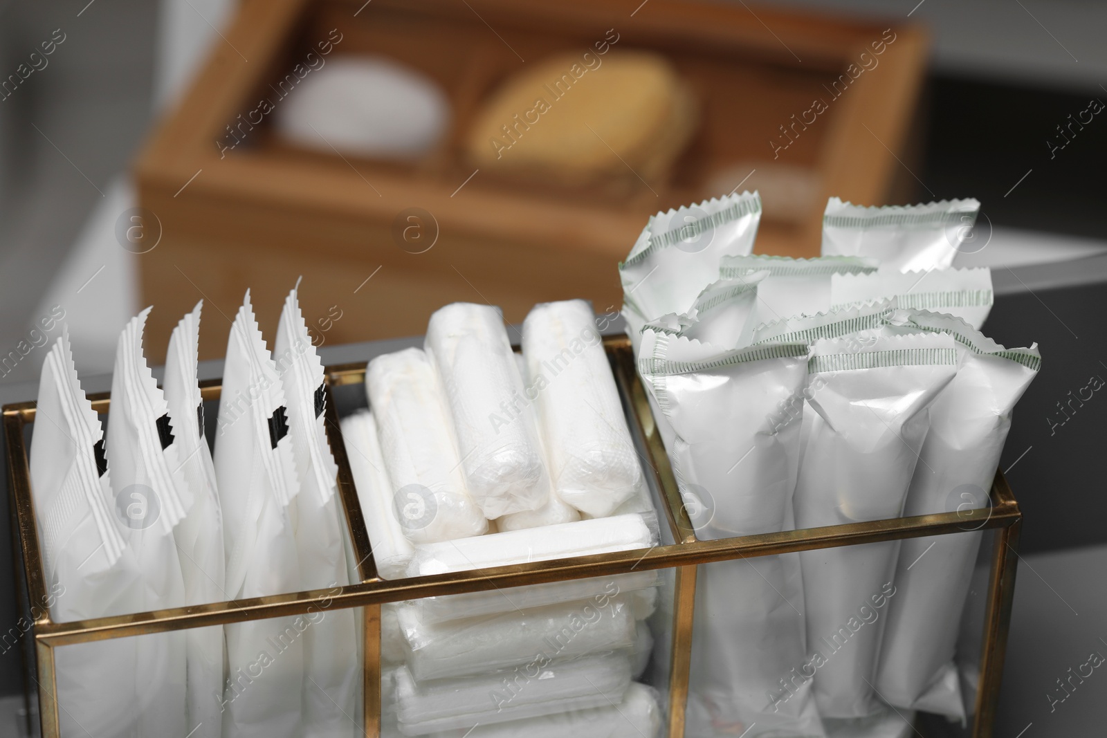 Photo of Organizer with different feminine hygiene products, closeup