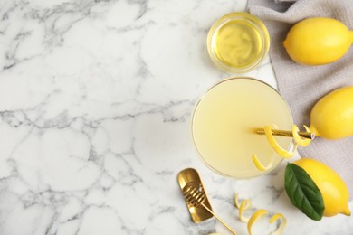 Photo of Delicious bee's knees cocktail and ingredients on white marble table, flat lay. Space for text