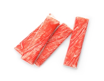 Photo of Delicious fresh crab sticks isolated on white, top view