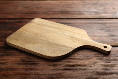 Photo of One new cutting board on wooden table