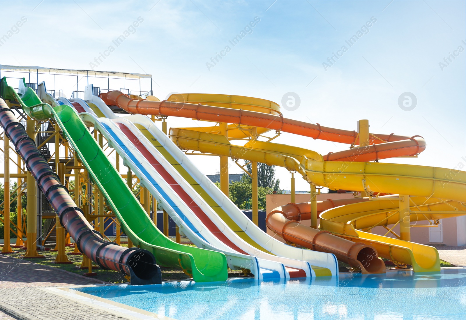 Photo of Different colorful slides in water park on sunny day