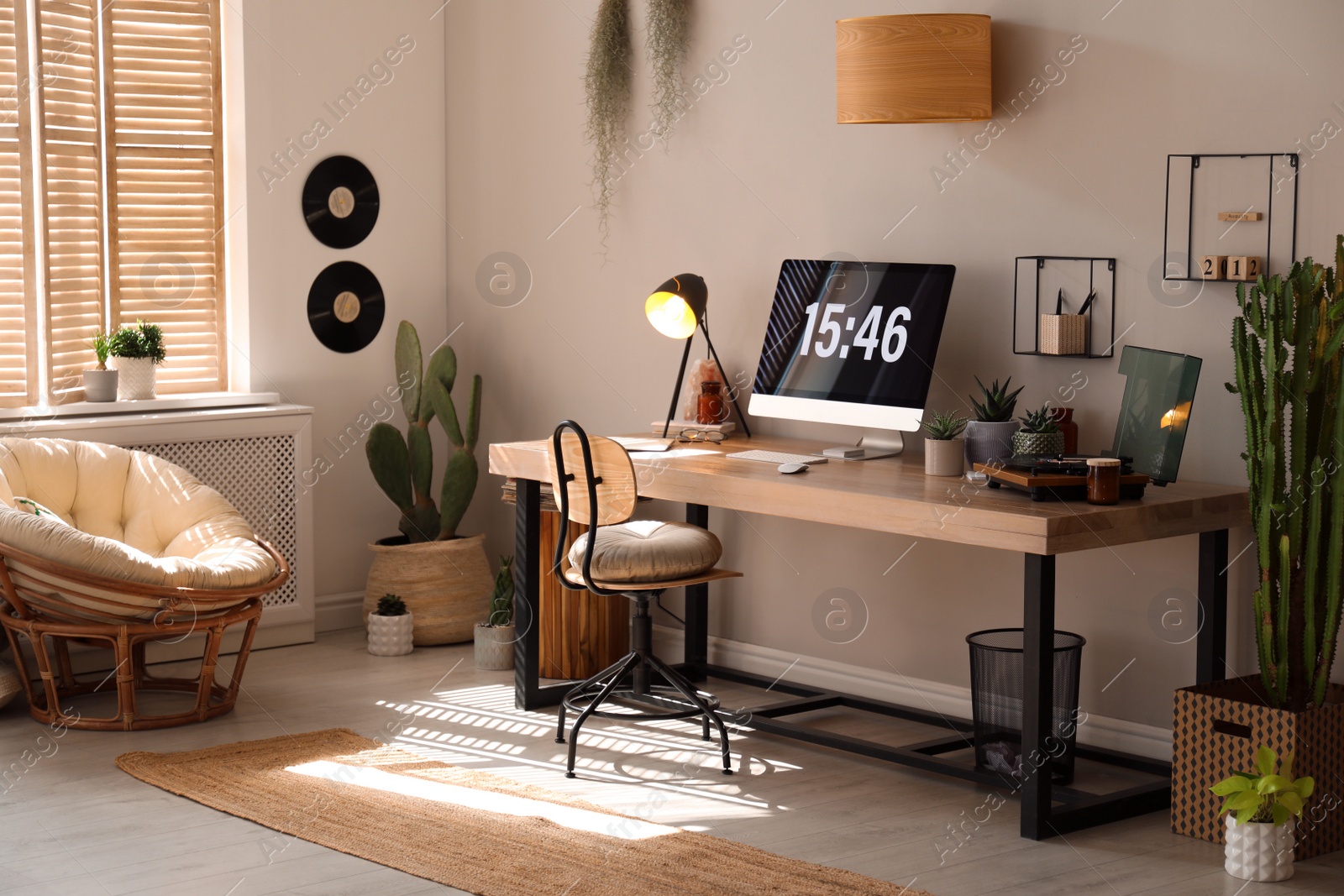 Photo of Room interior with comfortable workplace. Modern computer on wooden desk