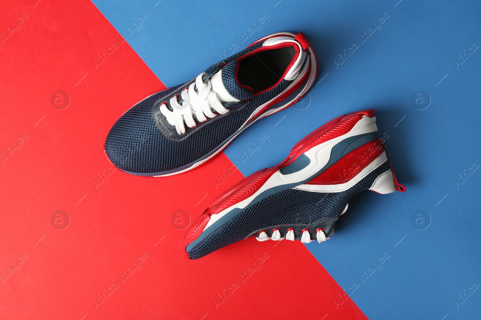 Photo of Flat lay composition of training shoes on color background