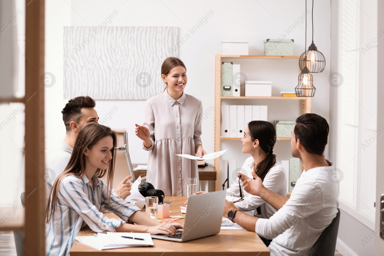 Photo of Team of professional journalists working in office