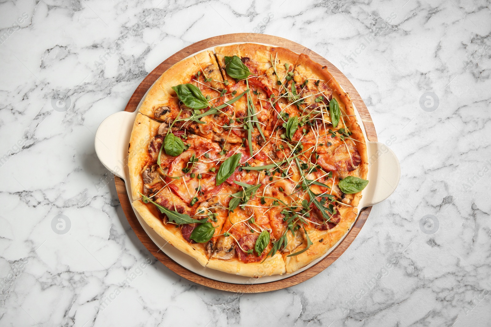 Photo of Tasty homemade pizza on table, top view