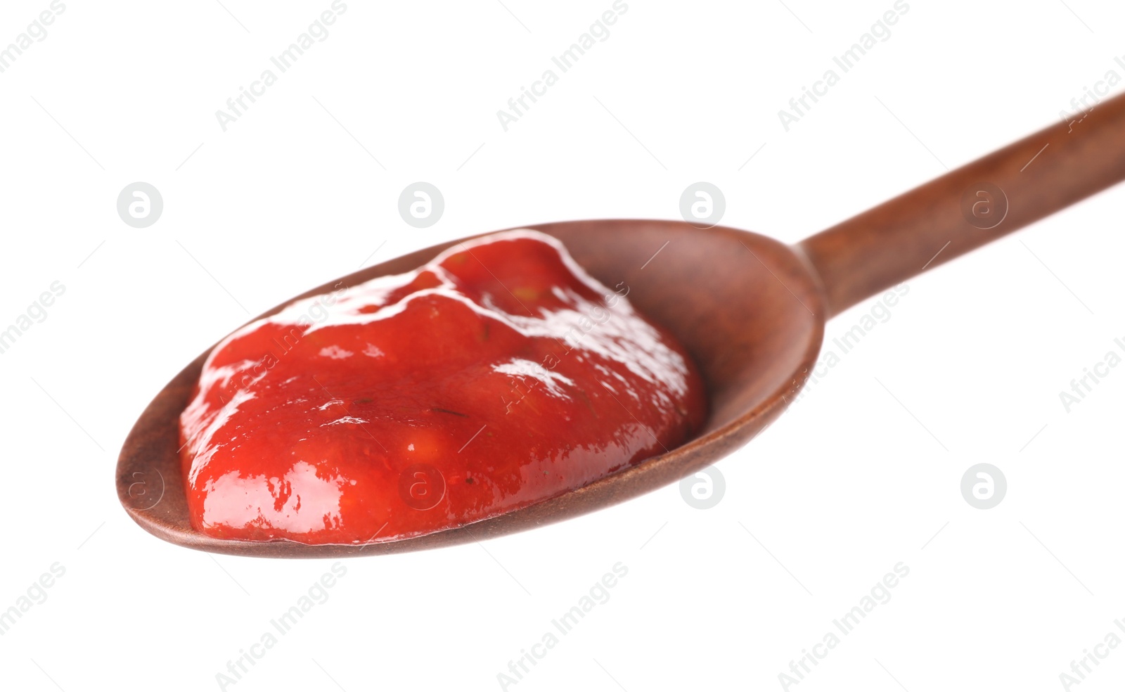 Photo of Wooden spoon with red sauce on white background