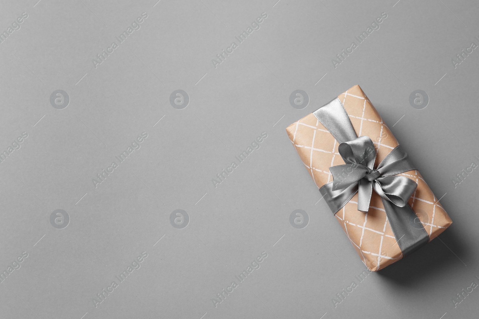 Photo of Beautiful gift box on gray background