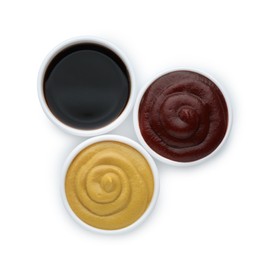 Many different sauces in bowls on white background, top view