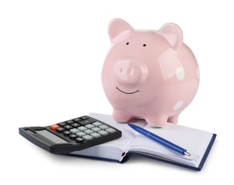 Photo of Calculator, pink piggy bank, notebook and pen isolated on white