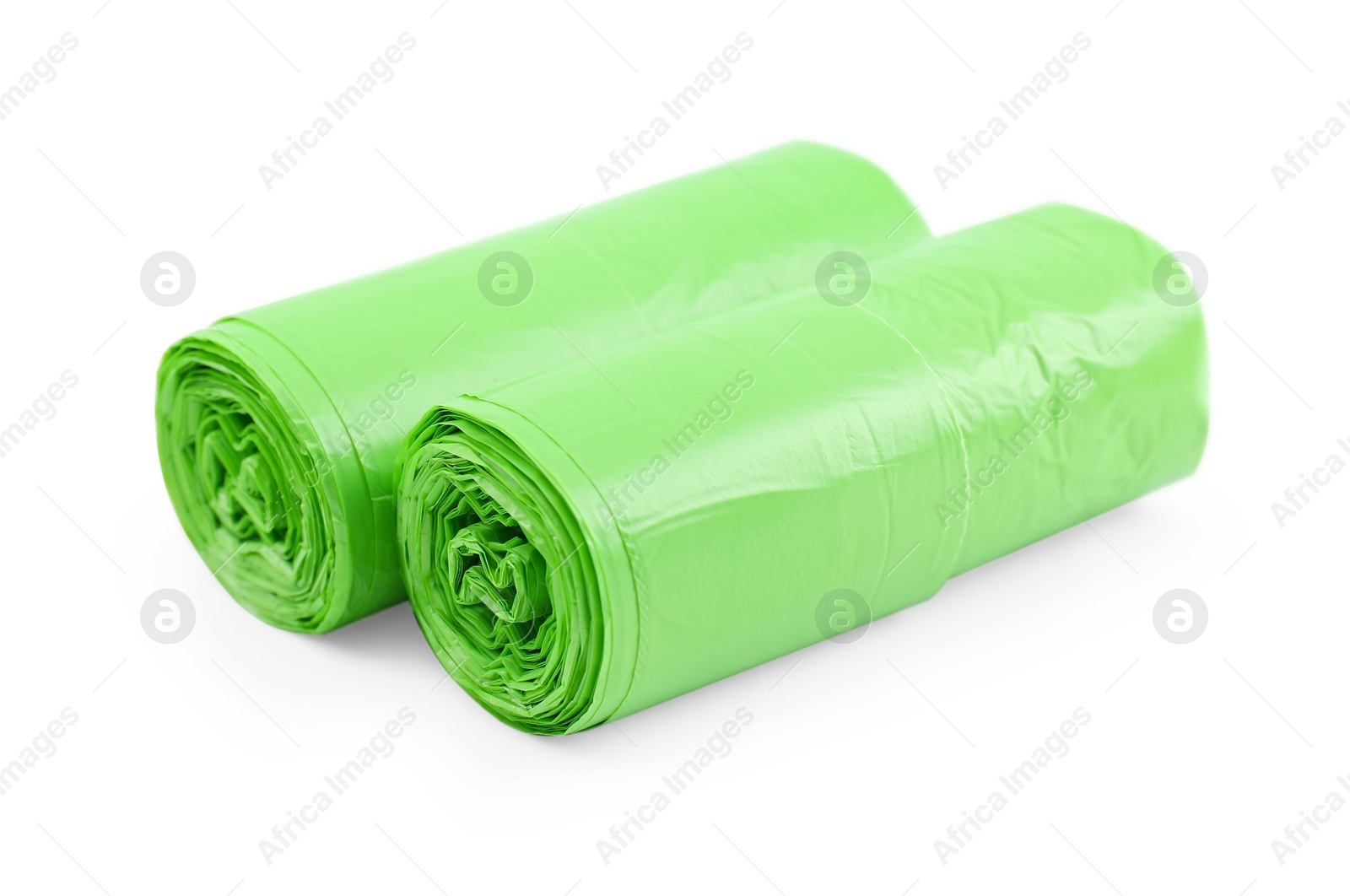 Photo of Two rolls of light green garbage bags isolated on white